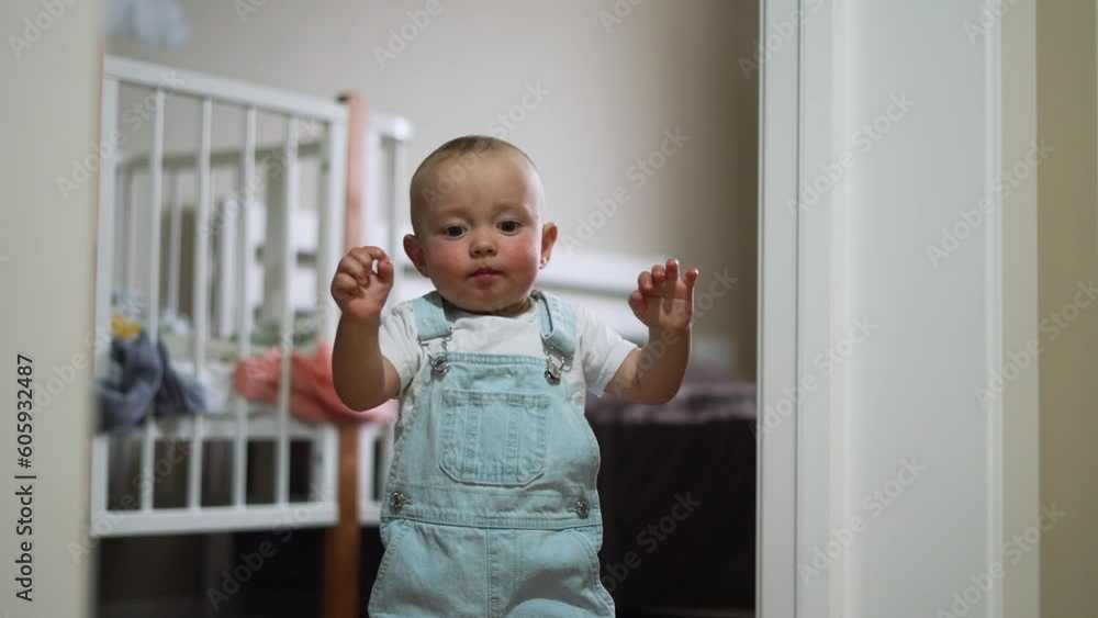 Baby's first steps. Toddler at home takes funny first steps. legs close-up. Baby's feet on floor at home. Kid's dream is to teaches to walk at home. Toddler learning to walk at home. walk baby teaches Baby's first steps. Toddler at home takes funny first steps. legs close-up. Baby's feet on floor at home. Kid's dream is to teaches to walk at home. Toddler learning to walk at home. walk baby teaches