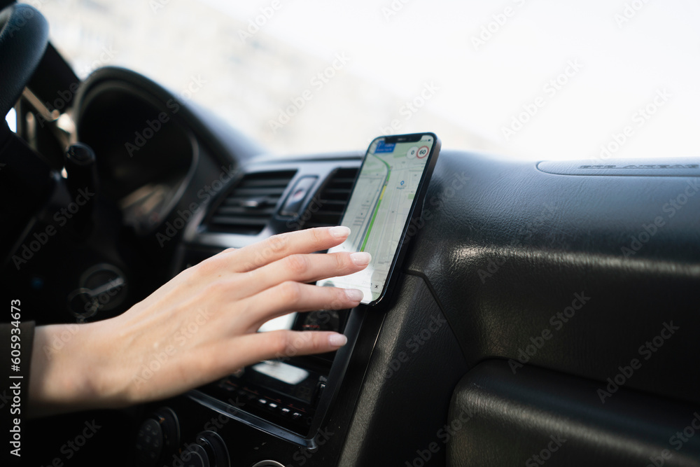 car driver touch smartphone using navigator