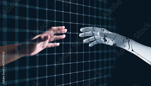 Hands of Robot and Human Touching together through computer moniter screen in dark background. Virtual Reality Augmented reality Artificial Intelligence technology digital twin driven smart concept