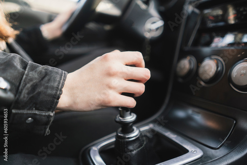 person holding a manual shift knob in the vehicle © Mihail