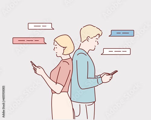 Smartphone Addiction. Serious man and woman standing back to back and using their smart phones. Hand drawn style vector design illustrations.