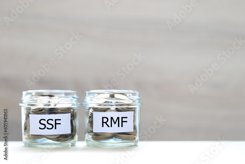 Retirement Mutual Fund, Coins money in the glass bottle on white background, Save money for prepare in future and pension retirement concept