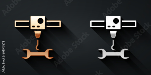 Gold and silver 3D printer wrench spanner icon isolated on black background. 3d printing. Long shadow style. Vector