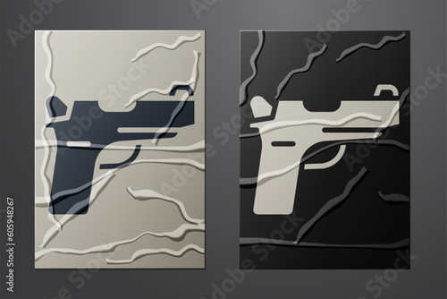 White Pistol or gun icon isolated on crumpled paper background. Police or military handgun. Small firearm. Paper art style. Vector