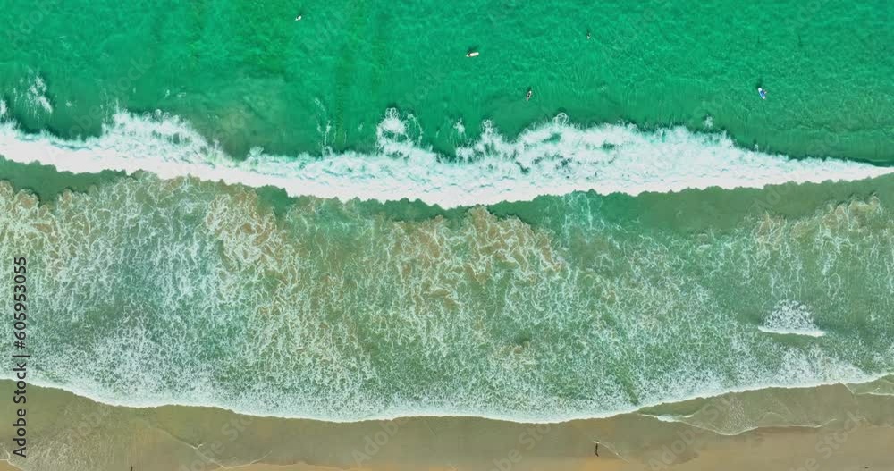 aerial top view sea waves seamless loop on the white sand beach. .Wave after wave swept towards the shore on white sand beach..green sea, white bubble waves,and clear sand landscape. Paradise beach. aerial top view sea waves seamless loop on the white sand beach. .Wave after wave swept towards the shore on white sand beach..green sea, white bubble waves,and clear sand landscape. Paradise beach.