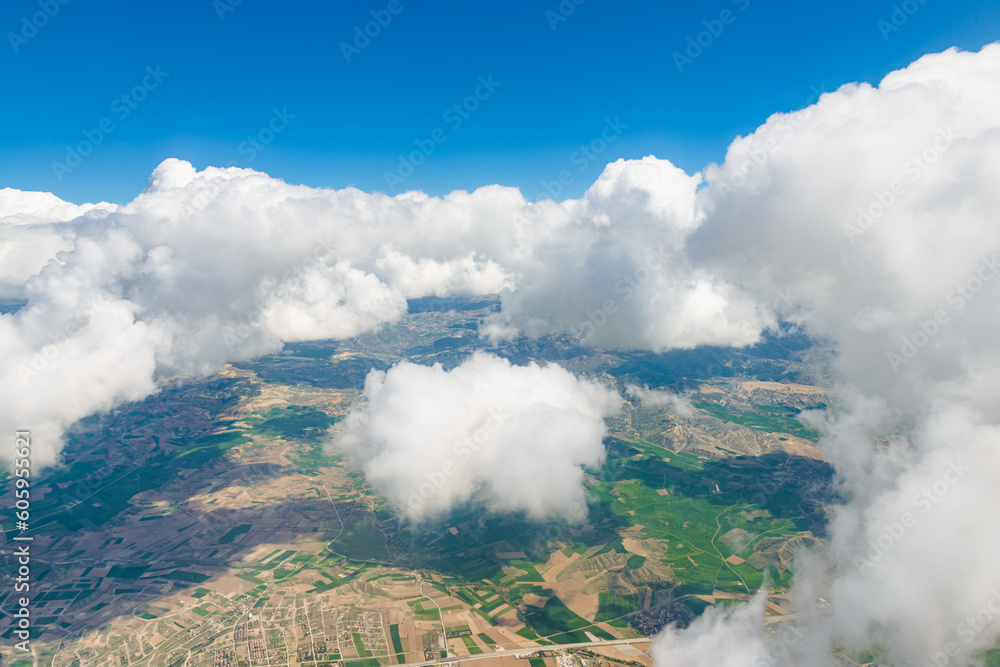 Aerial view on white fluffy clouds.