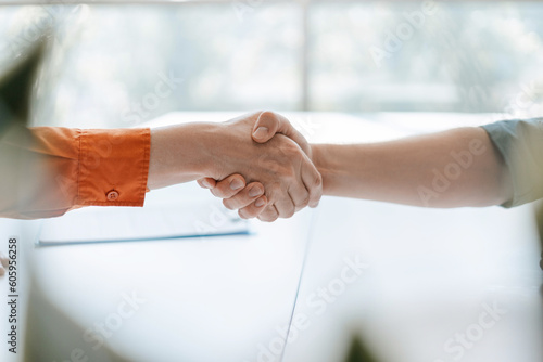 Fotografie Closeup hands of successful business people handshake on meeting, successful deal