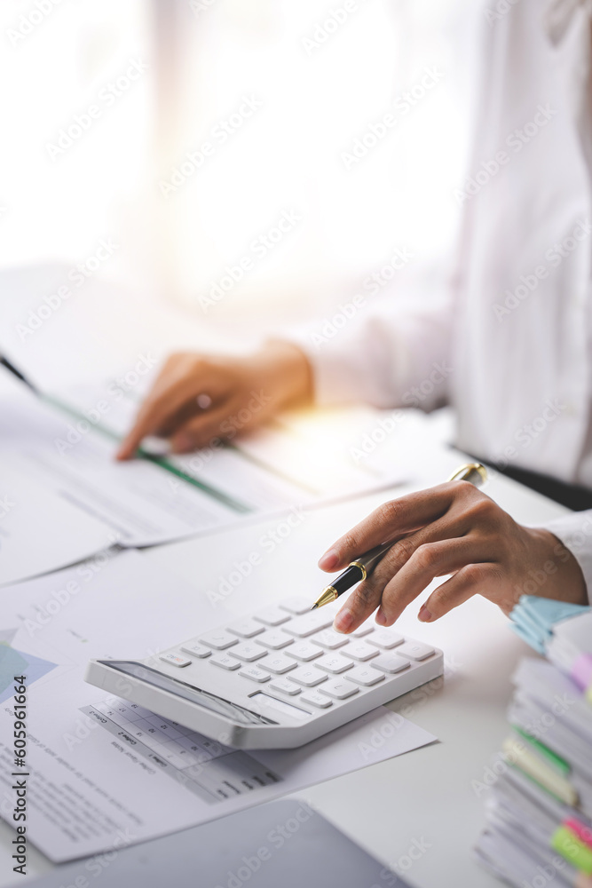 Portrait of a woman working on a tablet computer in a modern office. Make an account analysis report. real estate investment information financial and tax system concepts Portrait of a woman working on a tablet computer in a modern office. Make an account analysis report. real estate investment information financial and tax system concepts