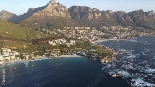 Scenic aerial view of coastline with beach in Cape Town, South Africa (camp's bay). City and ocean in foreground, mountain area in background
