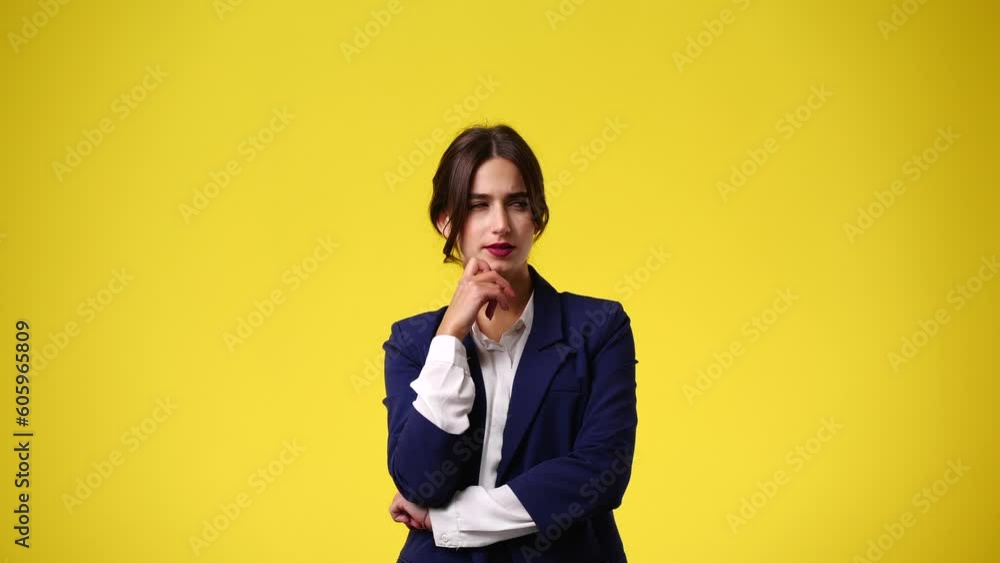 4k video of girl with cunning facial expression on yellow background. 4k video of girl with cunning facial expression on yellow background.