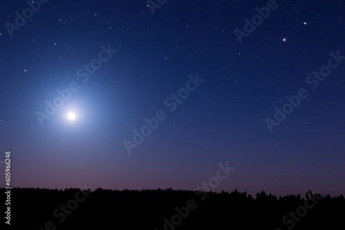 Wolf Moon. Super full moon with dark background. Madrid, Spain, Europe. Horizontal Photography. 25. January. 2024. Moon. Supermoon. Sulfur. Conjunction. Venus. Saturn. Jupiter. First moon year.