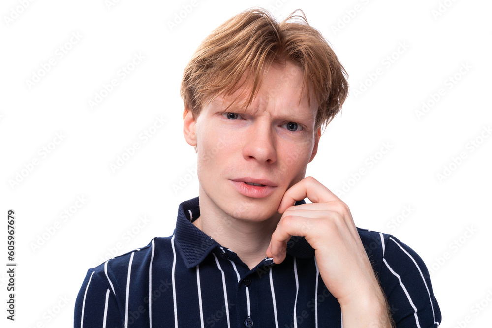 portrait of a well-groomed young blond guy in a striped polo shirt on a white background portrait of a well-groomed young blond guy in a striped polo shirt on a white background