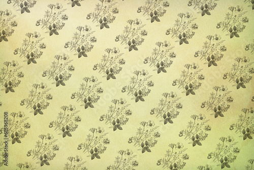 Old vintage wallpaper with a repeating floral pattern. Sheet of vintage notebook with flowers.