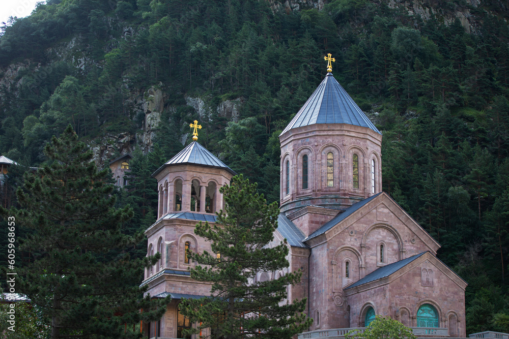 Beautiful Georgian church on the background of mountains.