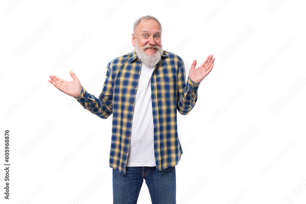 senior gray-haired retired man with a mustache and beard spreads his arms with his index finger and laughs senior gray-haired retired man with a mustache and beard spreads his arms with his index finger and laughs