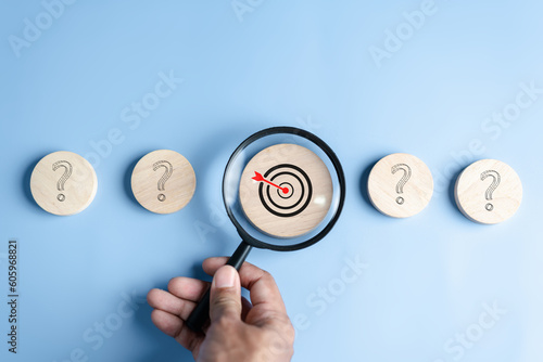 Magnifier focus to target solution target which among question icon, successful business and thinking solution strategy concept.