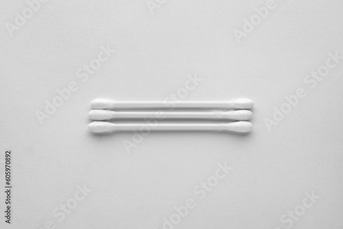 Clean cotton buds on white background  top view. Hygienic accessory