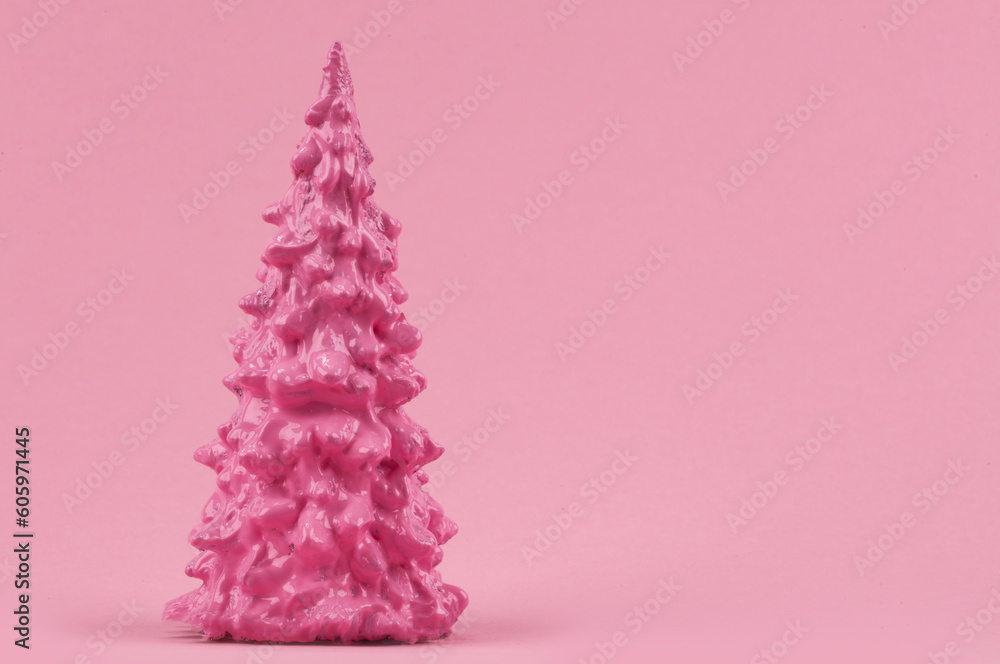Christmas composition. Pink Christmas tree on a pink background. Happy Holidays. minimal new year concept. Christmas composition. Pink Christmas tree on a pink background. Happy Holidays. minimal new year concept.