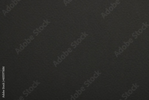 Texture of dark grey paper sheet as background, top view