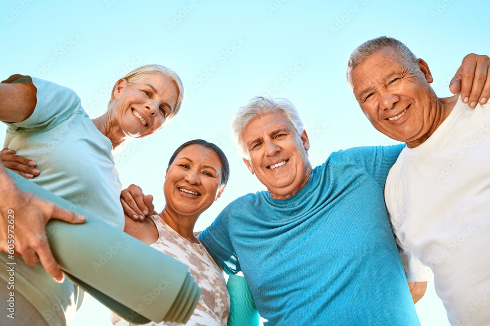 Fitness, portrait and senior friends at yoga outdoor at a wellness, health and spiritual resort. Happy, smile and low angle of a group of elderly people in a huddle at a pilates or meditation class. Fitness, portrait and senior friends at yoga outdoor at a wellness, health and spiritual resort. Happy, smile and low angle of a group of elderly people in a huddle at a pilates or meditation class.