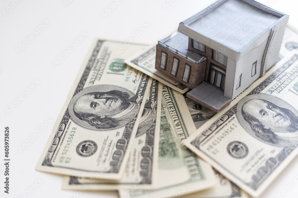 Miniature paper house with money Miniature paper house with money