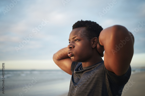Black man  exercise at beach and hands on head for fitness  workout or practice on mockup space. Stretching  thinking and African male person warm up at ocean for health  wellness or sports training.