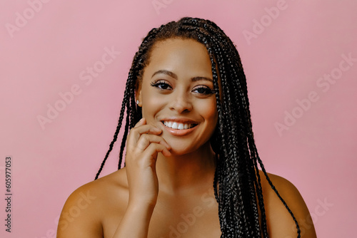 close up woman smiling with hand on chin