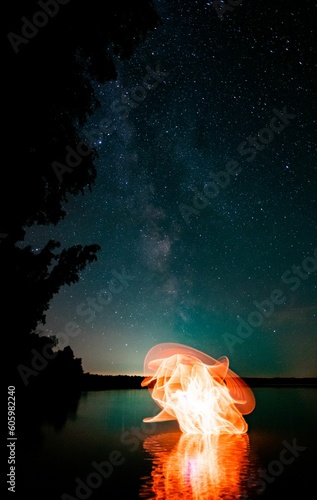 Beautiful light painting against the background of the starry sky.