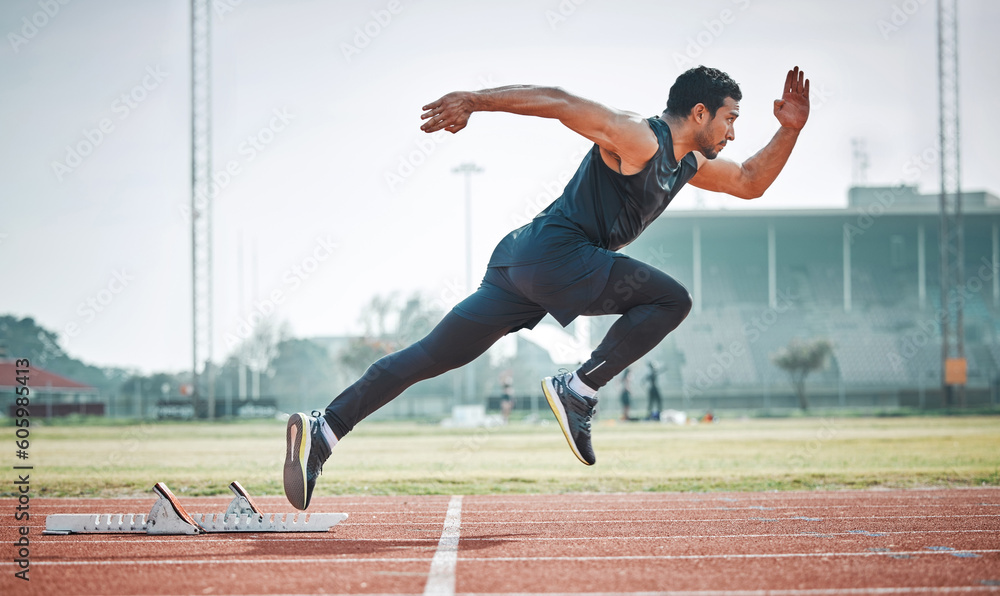 Fototapeta premium Stadium, man running and athlete on a runner and arena track for sprint race training. Fast, run and sports exercise of a male person in marathon for fitness and workout outdoor on a field for health