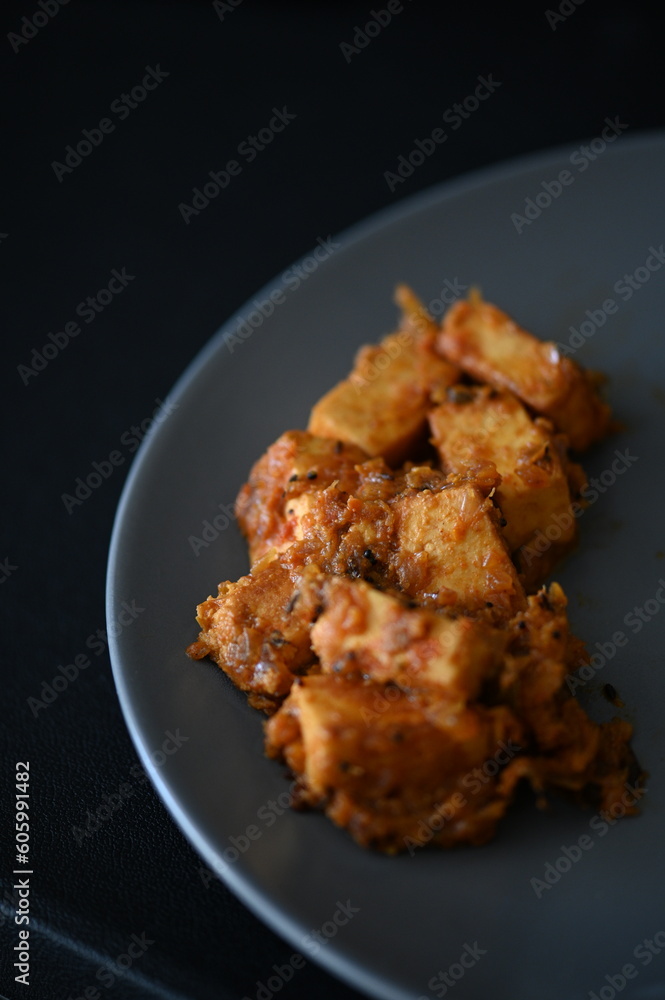Closeup of an Indian Food - Paneer Rogan Josh on a table Closeup of an Indian Food - Paneer Rogan Josh on a table