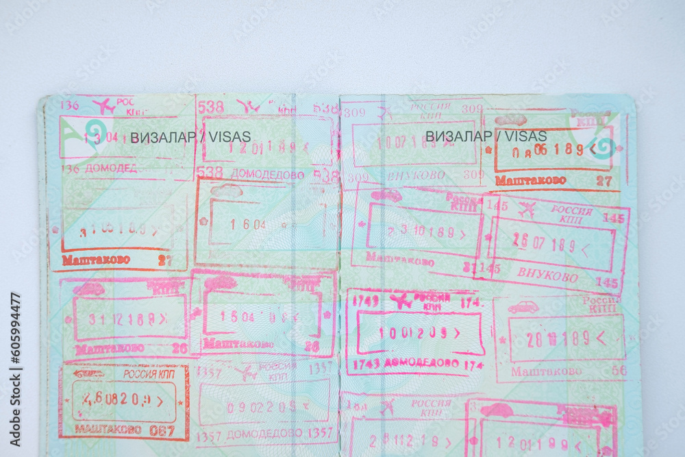 Kazakhstan national passport document for travel. A lot of stamps and visas on it