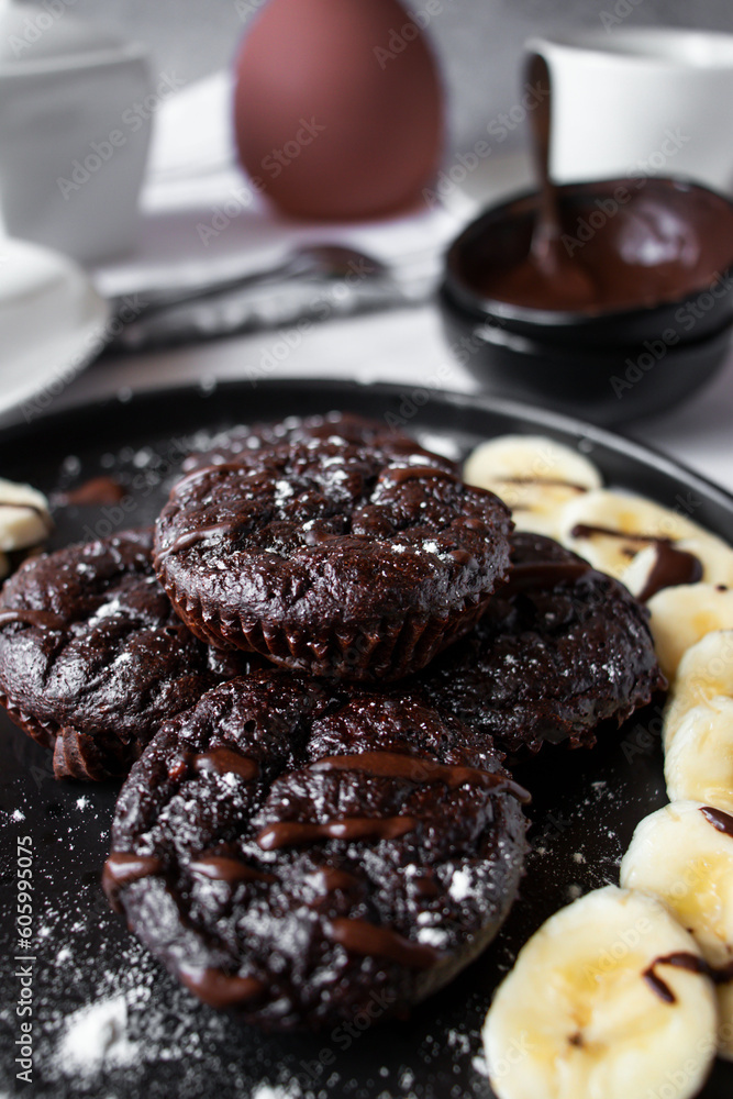 Delicious chocolate banana muffins. Dessert. On a white background Delicious chocolate banana muffins. Dessert. On a white background