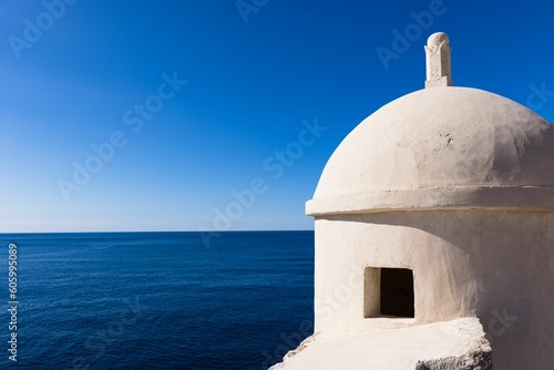 Dome of a white building with a view of beautiful sea under the blue sky