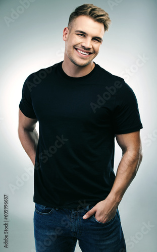 Portrait, smile and casual man in studio for fashion, style and cool guy with confidence. Person, face and smiling or laughing with happiness or hands in denim jeans pocket on white background