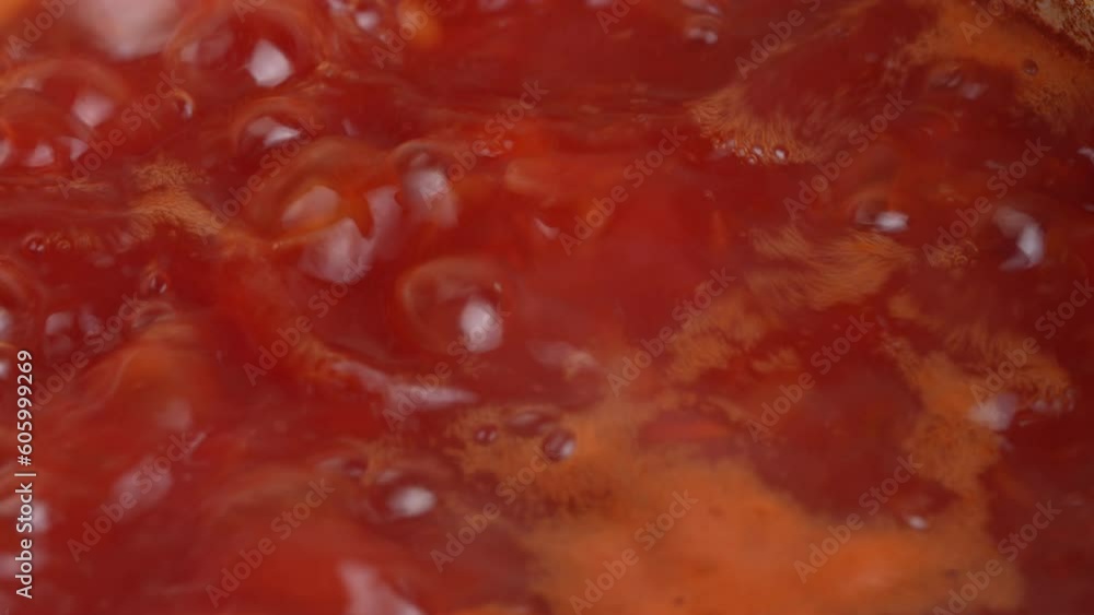Boiling tasty and juicy red borsch, beet soup in saucepan, close up. Cooking food recipe and traditional Ukrainian dish cuisine. Domestic healthy food. Red beetroot vegetable soup, boiling in pot Boiling tasty and juicy red borsch, beet soup in saucepan, close up. Cooking food recipe and traditional Ukrainian dish cuisine. Domestic healthy food. Red beetroot vegetable soup, boiling in pot