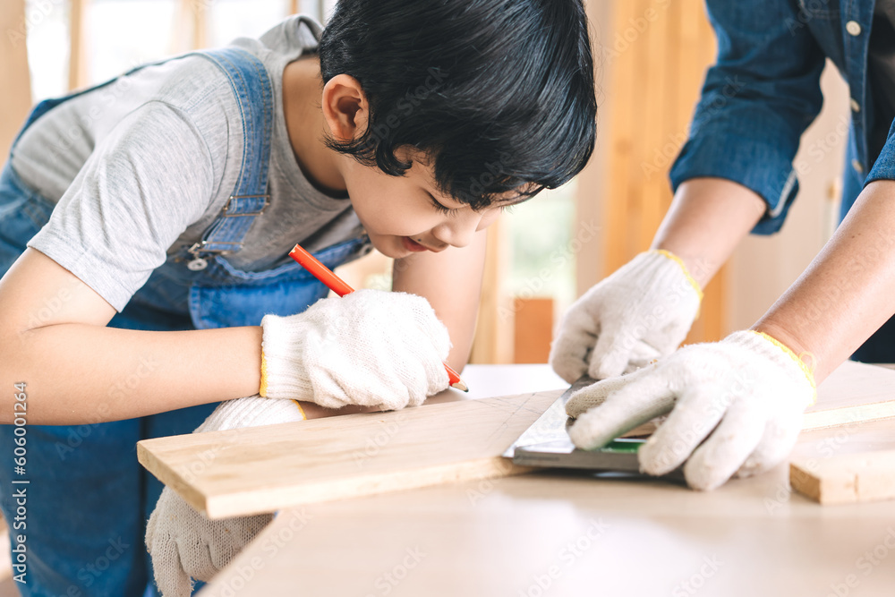 Southeast asian family father and son living together homeschooling Southeast asian family father and son living together homeschooling