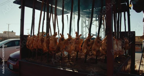 Chicken roast in a big grilling machine, cart captured in a street in Quetta, Pakistan photo