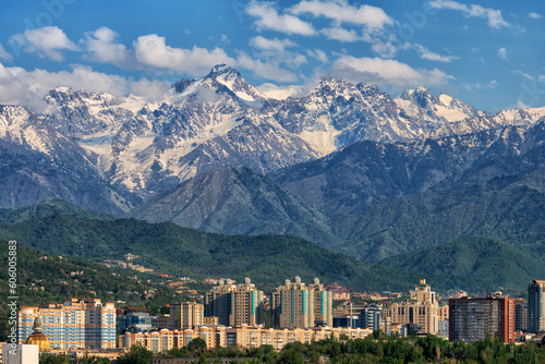 The peaks of the mountains of the Zailiysky Alatau over the Kazakh city of Almaty photo