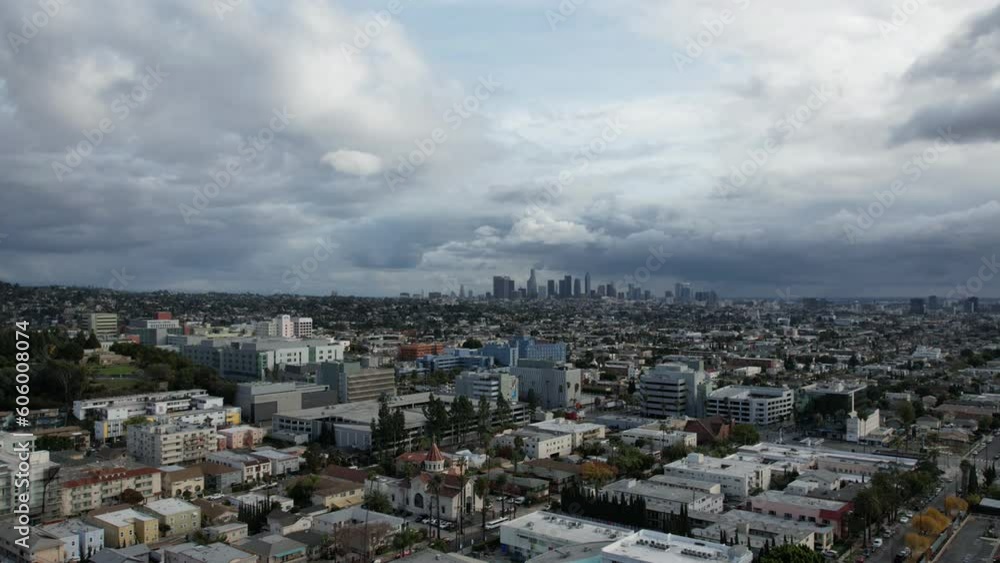 Time lapse of a cloudy sky over a cityscape Time lapse of a cloudy sky over a cityscape