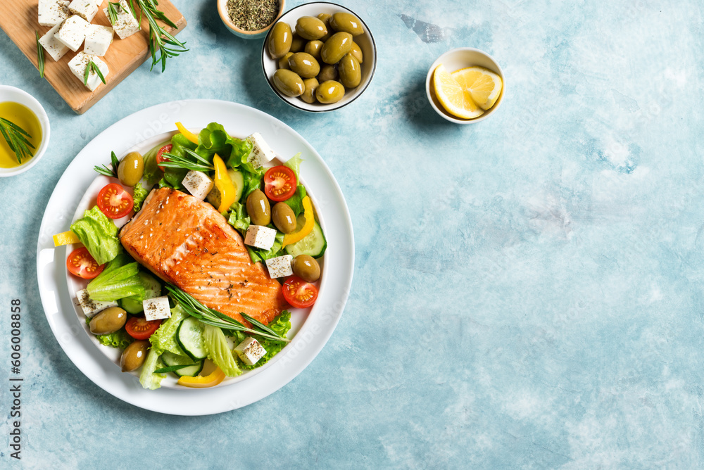 Grilled salmon fish fillet and greek salad