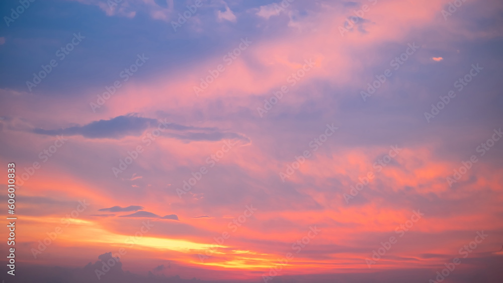 Obraz premium beautiful , luxury soft gradient orange gold clouds and sunlight on the blue sky perfect for the background, take in everning,Twilight