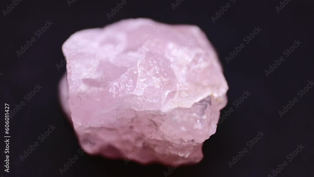 Macro shot of Rose quartz mineral from Brazil on purple background Macro shot of Rose quartz mineral from Brazil on purple background