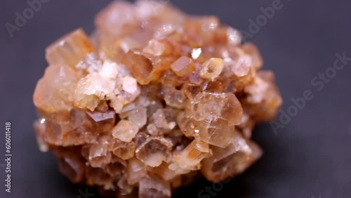 Macro shot of aragonite mineral from Marocco on purple background