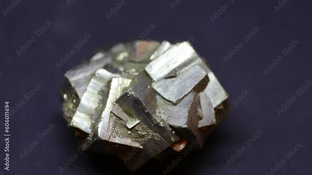 Macro shot of Pyrite mineral from Madagascar on purple background Macro shot of Pyrite mineral from Madagascar on purple background