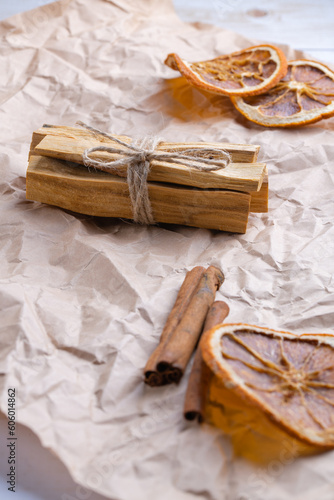Natural incense for home scenting and meditation: palo santo sticks, cinnamon sticks and orange slices
