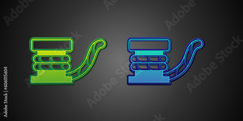 Green and blue Marine bollard with rope tied on pier icon isolated on black background. Vector