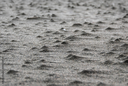 Close-up shot of lumpy sand on the beach photo