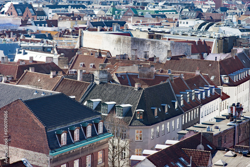 Aerial cityscape of the skyline with many brown roofs of the center of Copenhagen in Denmark
