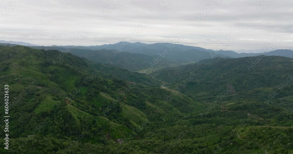 Mountains and hills with green forest and trees in the tropics. Sumatra, Indonesia. Mountains and hills with green forest and trees in the tropics. Sumatra, Indonesia.