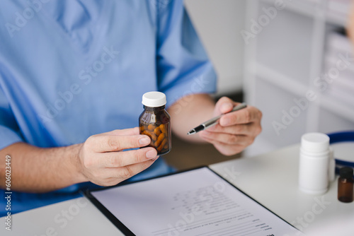 Doctor recommending medicine  how to take medicine  examination  treatment. Medical and health concept.